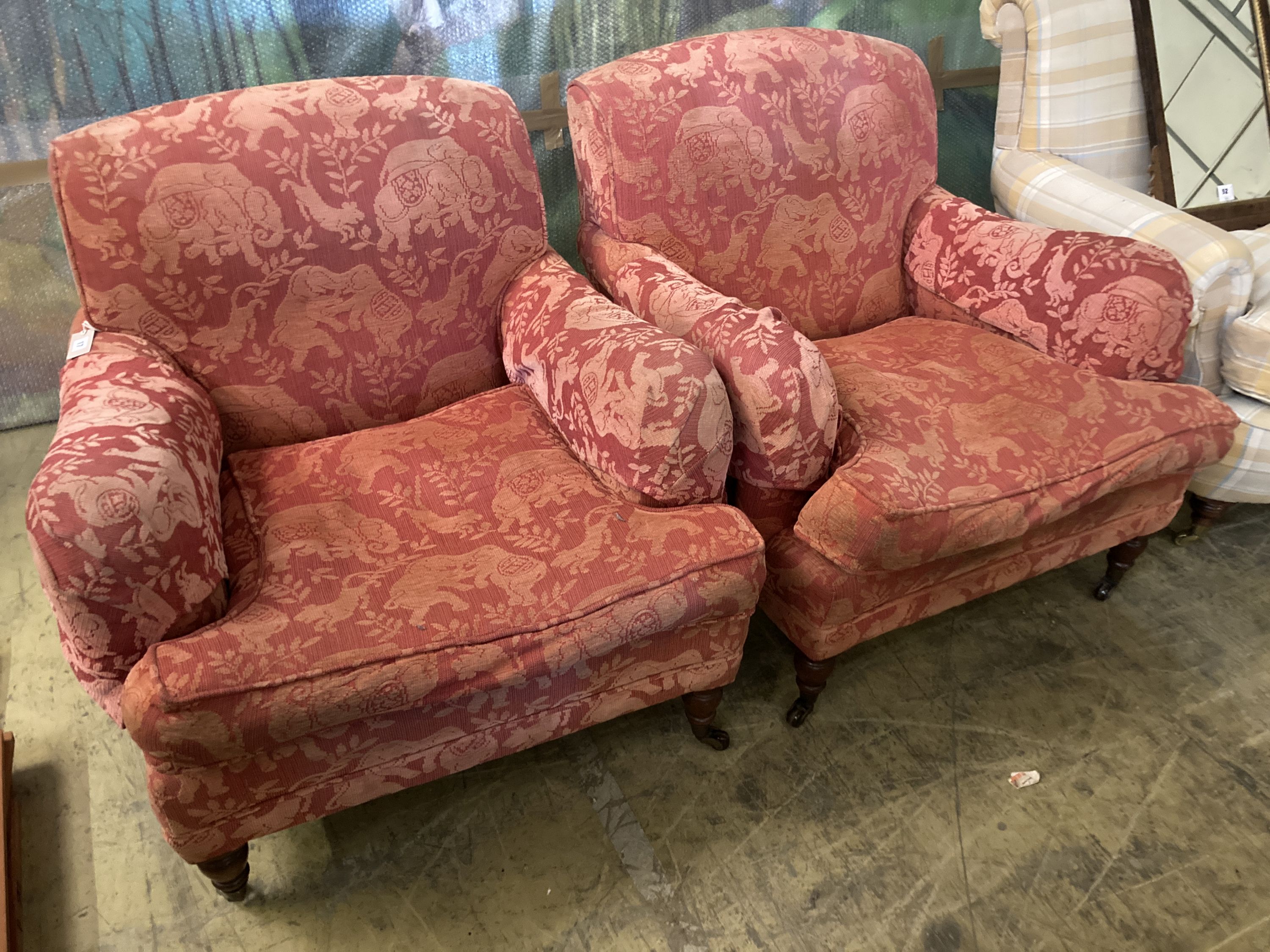 A pair of late Victorian style upholstered lounge armchairs, width 88cm, depth 98cm, height 83cm